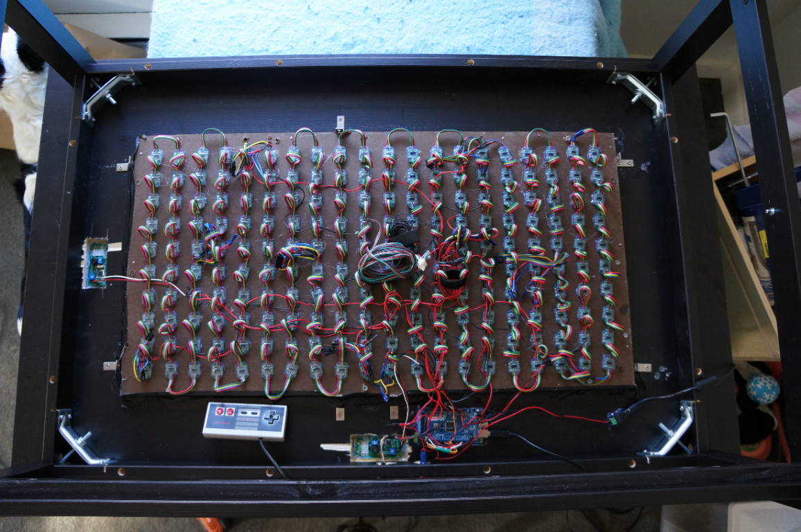 The underside of the LED game table, showing its lights and wiring